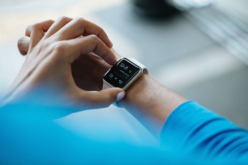 person clicking Apple Watch smartwatch