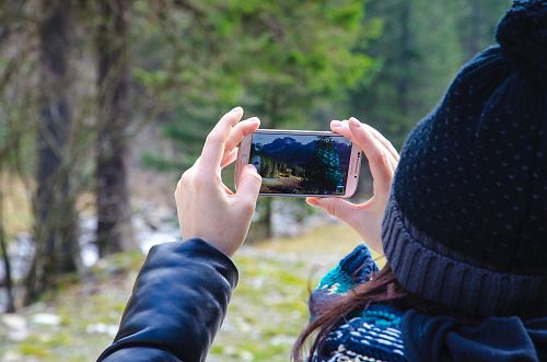 person holding silver Samsung smartphone