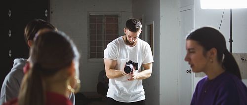 person taking photo of people during daytime