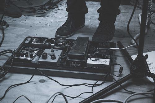 person wearing pair of black sneakers