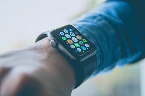 person wearing space gray aluminum case Apple Watch