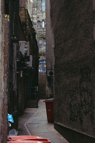 photo of red plastic trash bin