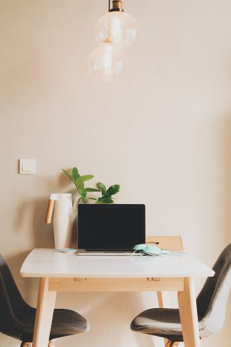 silver laptop computer on table