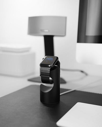 space black case Apple Watch on magnetic charger