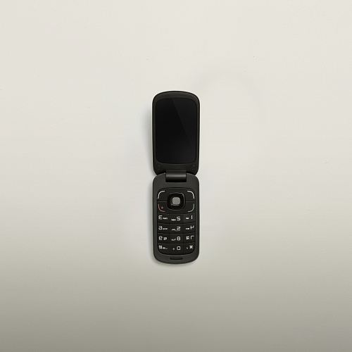 turned-off black flip-phone
