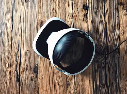 white and black Bluetooth headphones