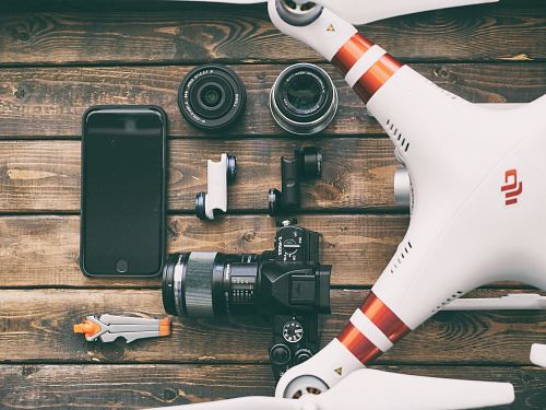 white and red DJI quadcopter drone