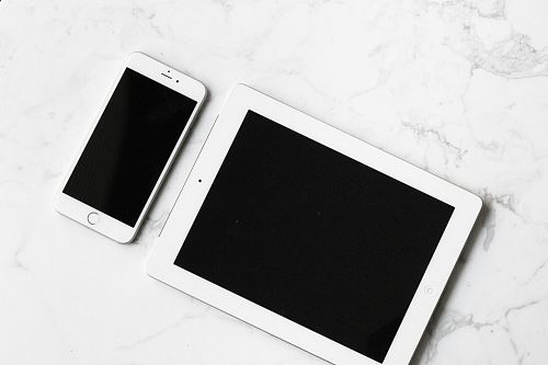 white iPad and silver iPhone 6