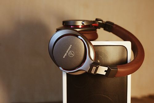 wireless headphones on top of speaker