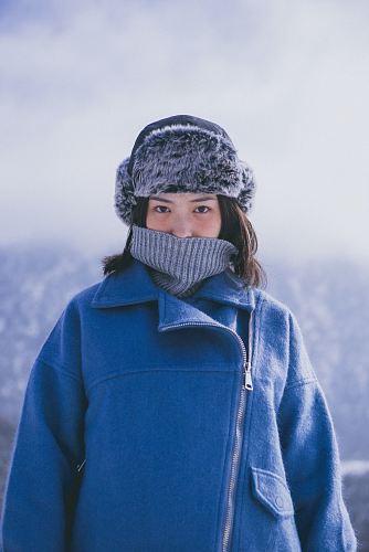 woman in blue jacket