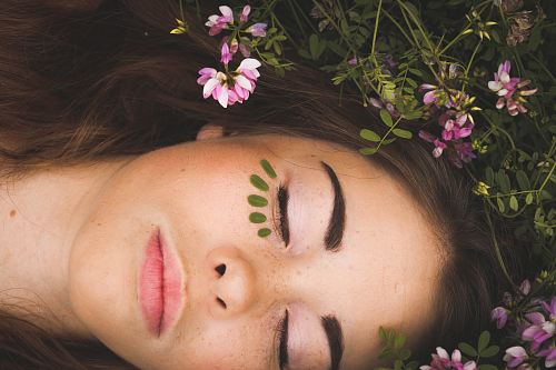 woman sleeping with pink flowers