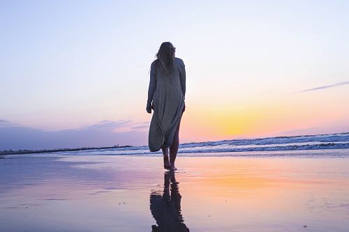 woman standing on beachfront