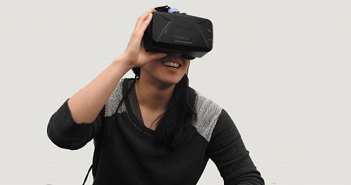 woman wearing black VR goggles