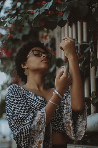 woman wearing eyeglasses and flare sleeve crop top
