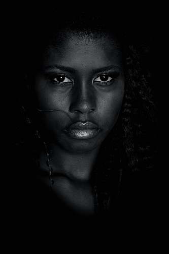 human grayscale photo of woman with silver necklace person