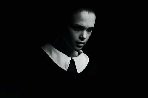 human woman in black v neck shirt person