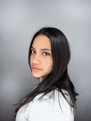 face woman in white crew neck shirt hair