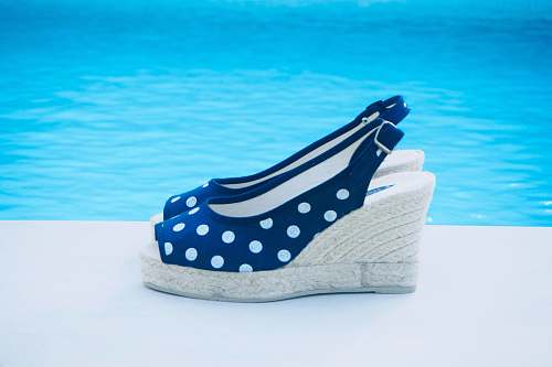 apparel pair of blue and white polka dot wedge heeled sandals shoe