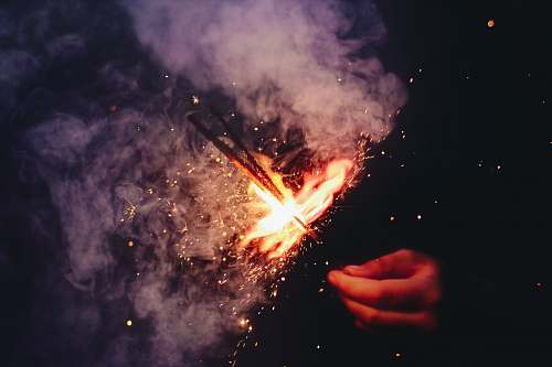 sparkler person lighting the sparkler with smoke sparkle
