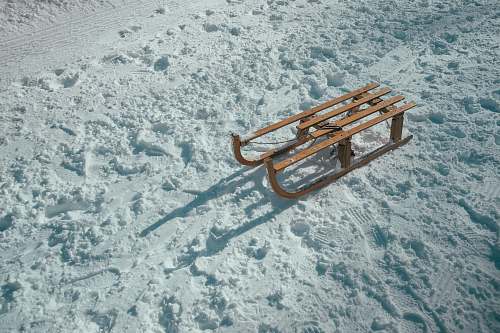 winter brown sled on snow during daytime sleigh