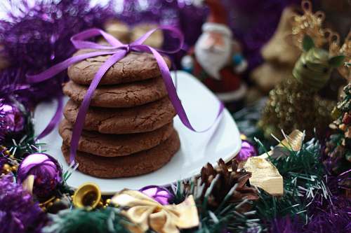 animal crinkles with purple ribbon on white ceramic saucer mammal