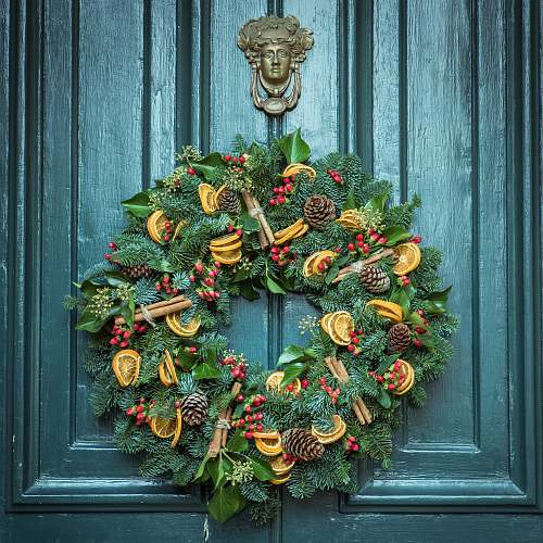 wreath photo of green door wreath mounted in green wooden door pottery
