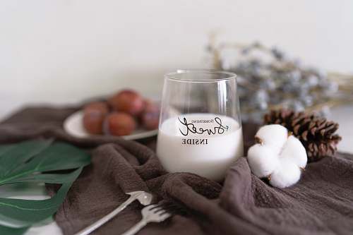 brown white liquid in glass cup milk