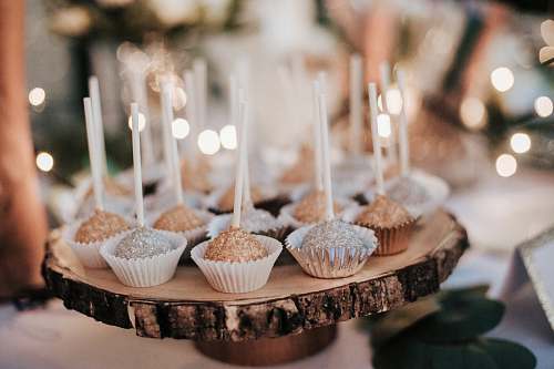cake cupcakes on brown log tray dessert