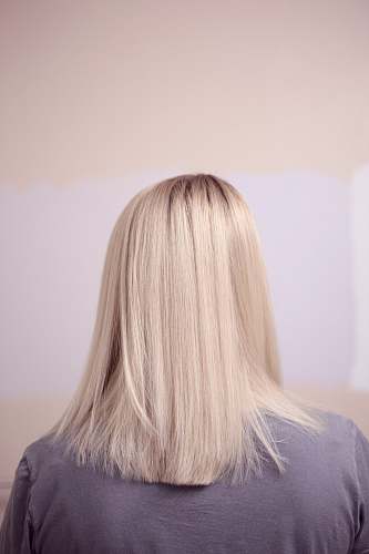 blonde woman wearing gray top woman