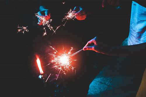 night people holding sparklers sparkle