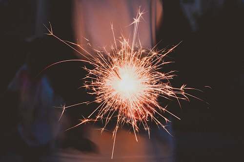 night timelapse photography of sparkler sparkle