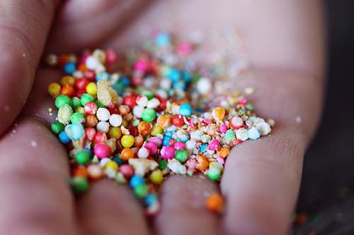 sweets ball candies on person's palm confectionery