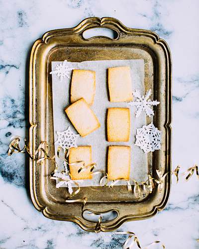 christmas brass tray on white marble surface holiday