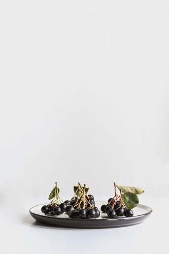 fruit bunch of grapes on ceramic plate dish