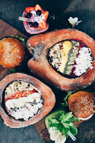 bali flat-lay of hamburger, fruit salad, and strawberry shake indonesia