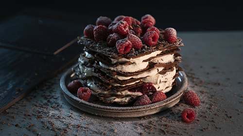 flora red raspberries on chocolate and cream cake raspberry