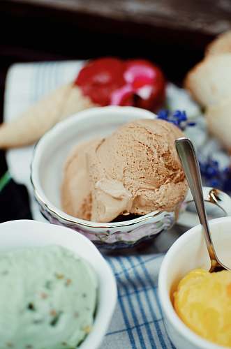 dessert three assorted-flavor ice cream on bowls cream