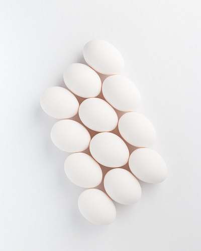 egg twelve white eggs on white surface mae