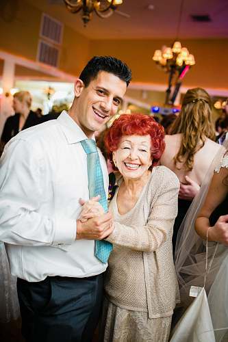 person man and grandmother dancing people