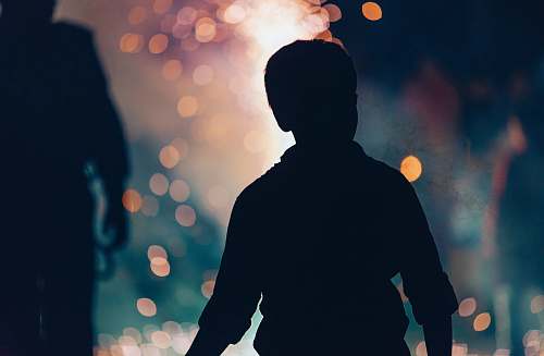 people silhouette photography of boy beside woman silhouette