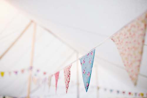flag closeup photo of blue and white buntings cloth