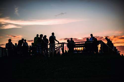 human silhouette of people standing on the balcony person