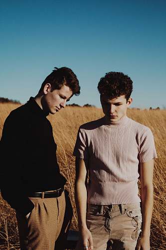 human two men standing on grass field people