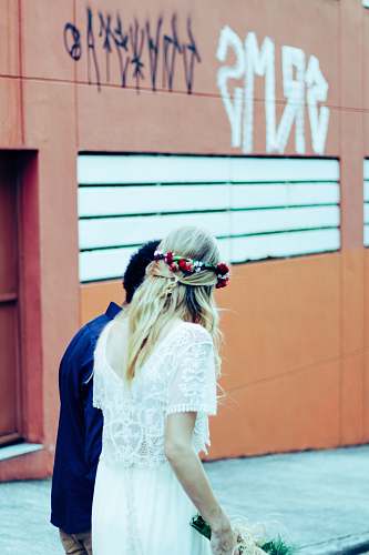 human woman and man standing near wall wedding