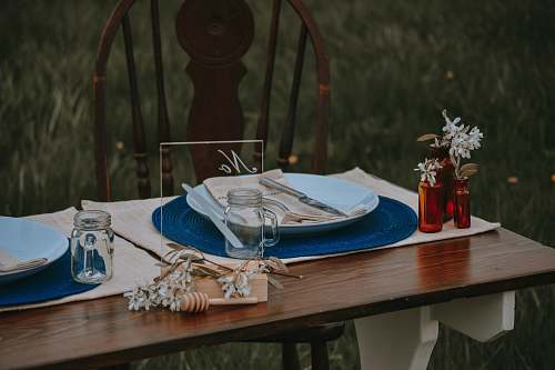jar round ceramic table with silver spoon and fork wedding