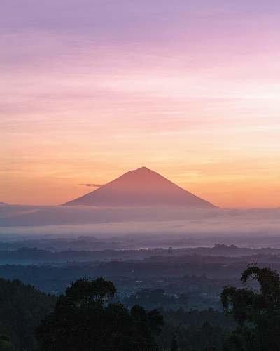 sunrise mountain under orange sky bali