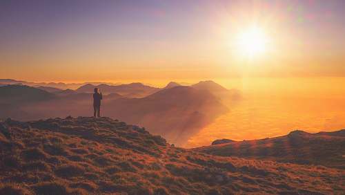sunrise person standing on mountain sky