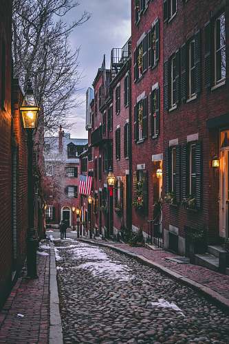 cobblestone USA flag on street during daytime path