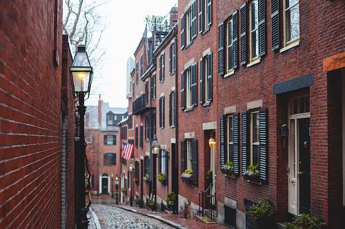 boston brown concrete building with patio light during daytime brick
