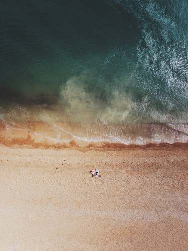 water aerial photography of shore sea